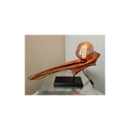 Wooden lamp with a glass shade on a white background