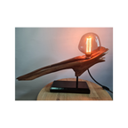 Wooden lamp with a glass bulb on a white background