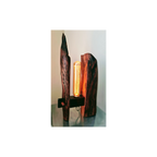Wooden lamp with a unique design on a reflective surface