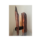 Wooden table lamp with a unique design on a neutral background