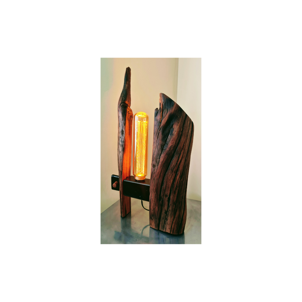 Wooden lamp with a glowing orange light bulb on a white background