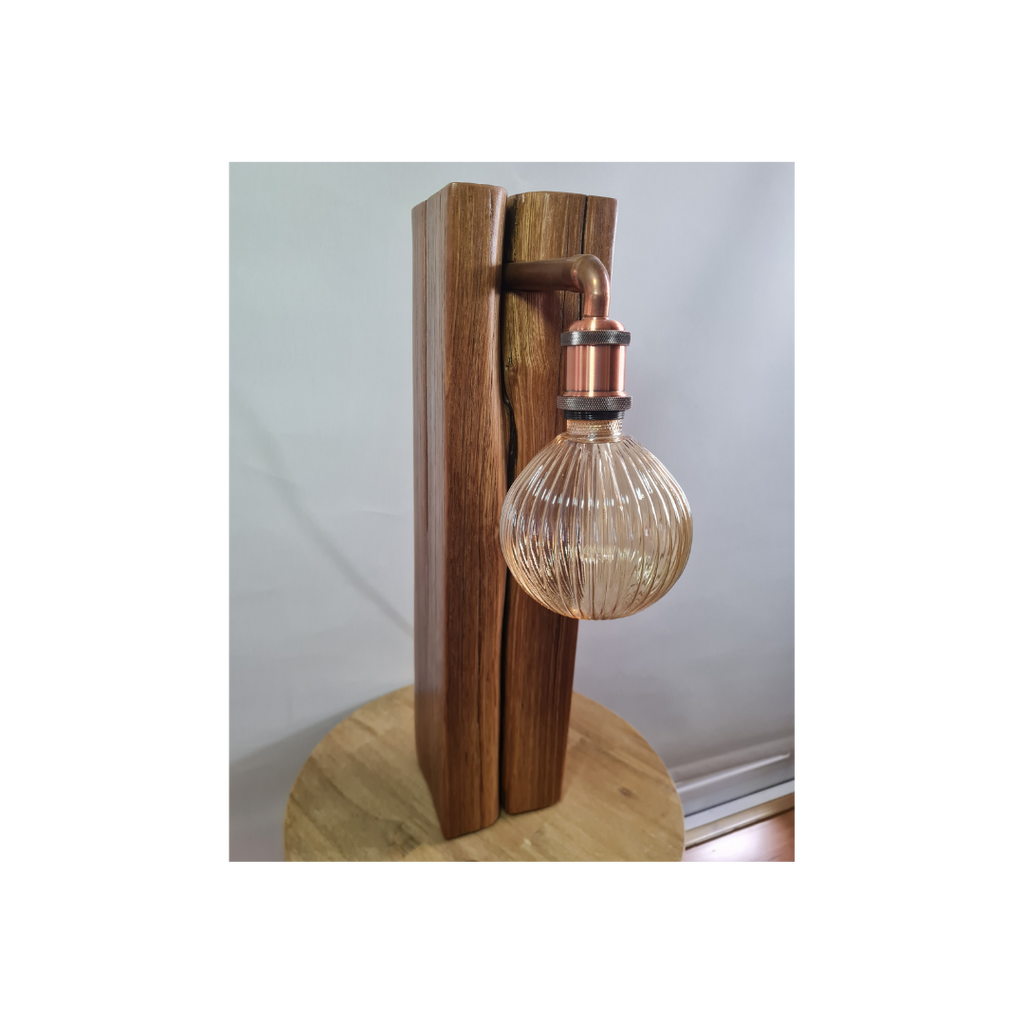 Wooden table lamp with a glass bulb on a white background