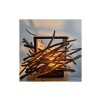 Lamp made of intertwined branches with a warm glow on a blurred background