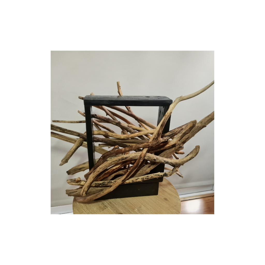 Lamp made of intertwined branches with a white background
