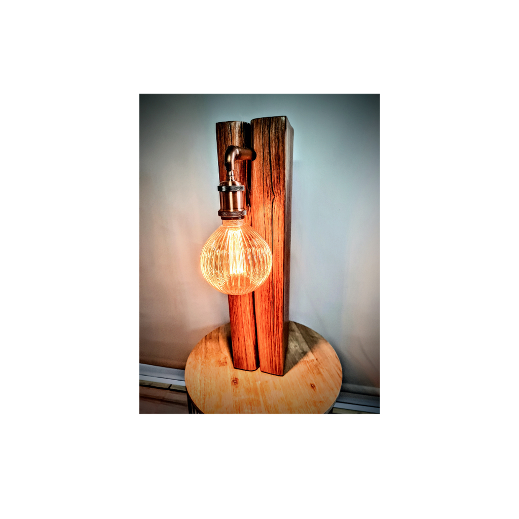 Wooden lamp with a glowing light bulb on a white background