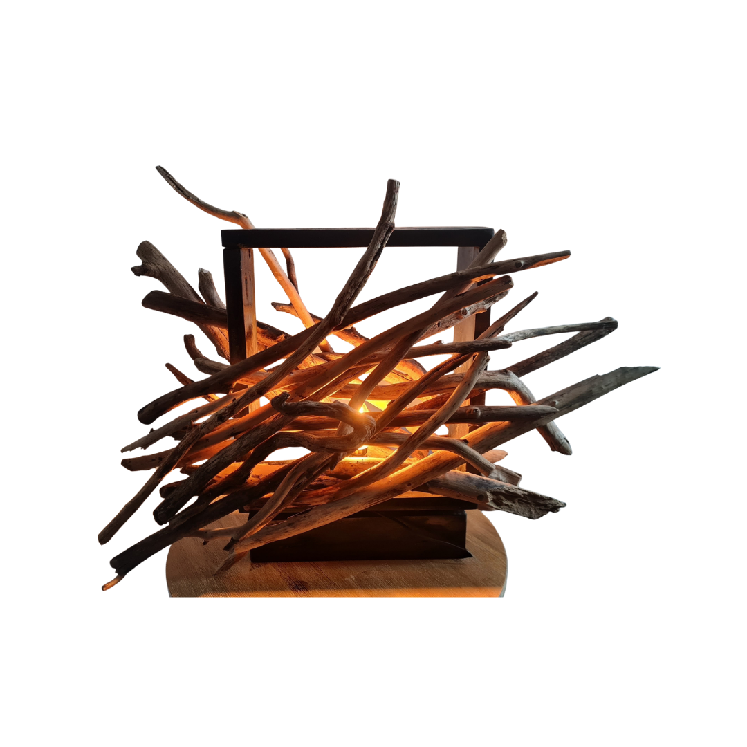 Driftwood lamp with a warm glow on a white background