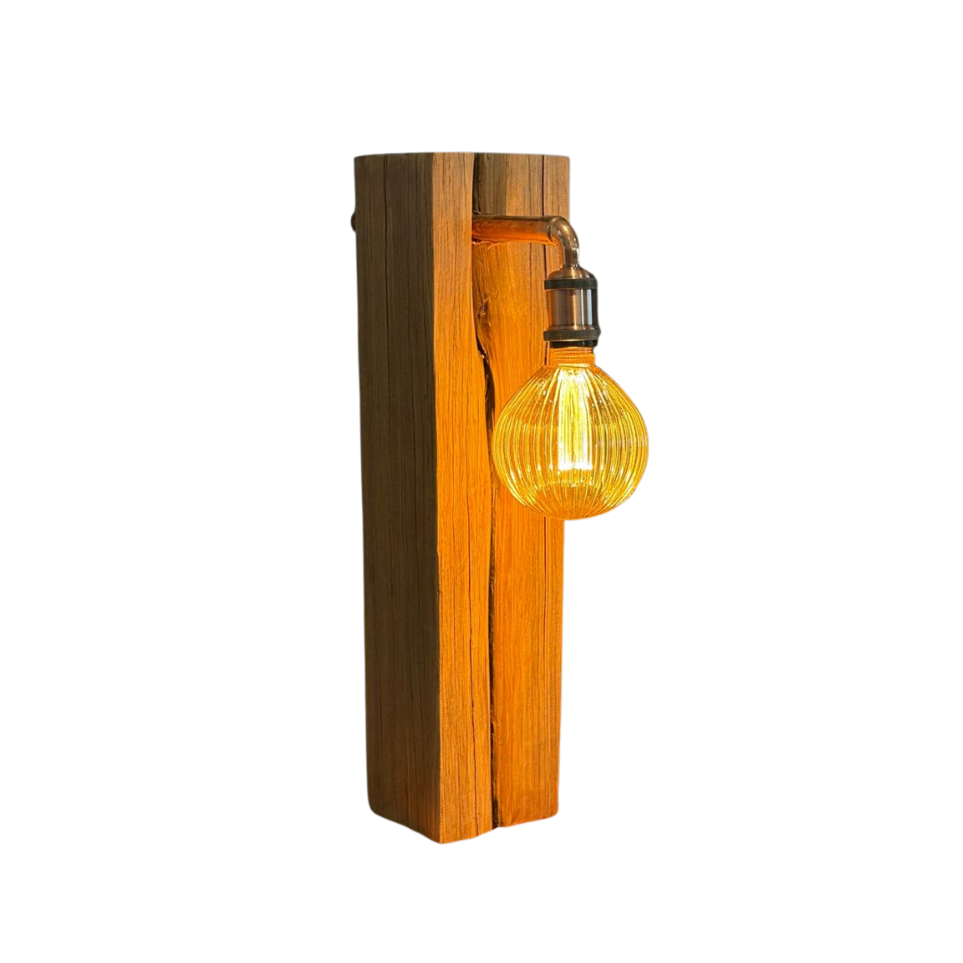 Wooden table lamp with a lit bulb on a white background