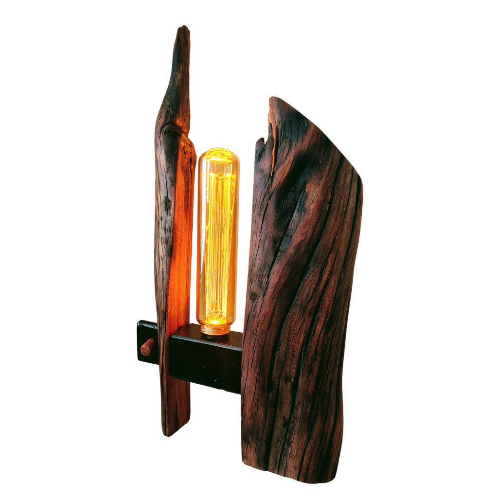 Wooden lamp with a unique design and a glowing bulb on a white background
